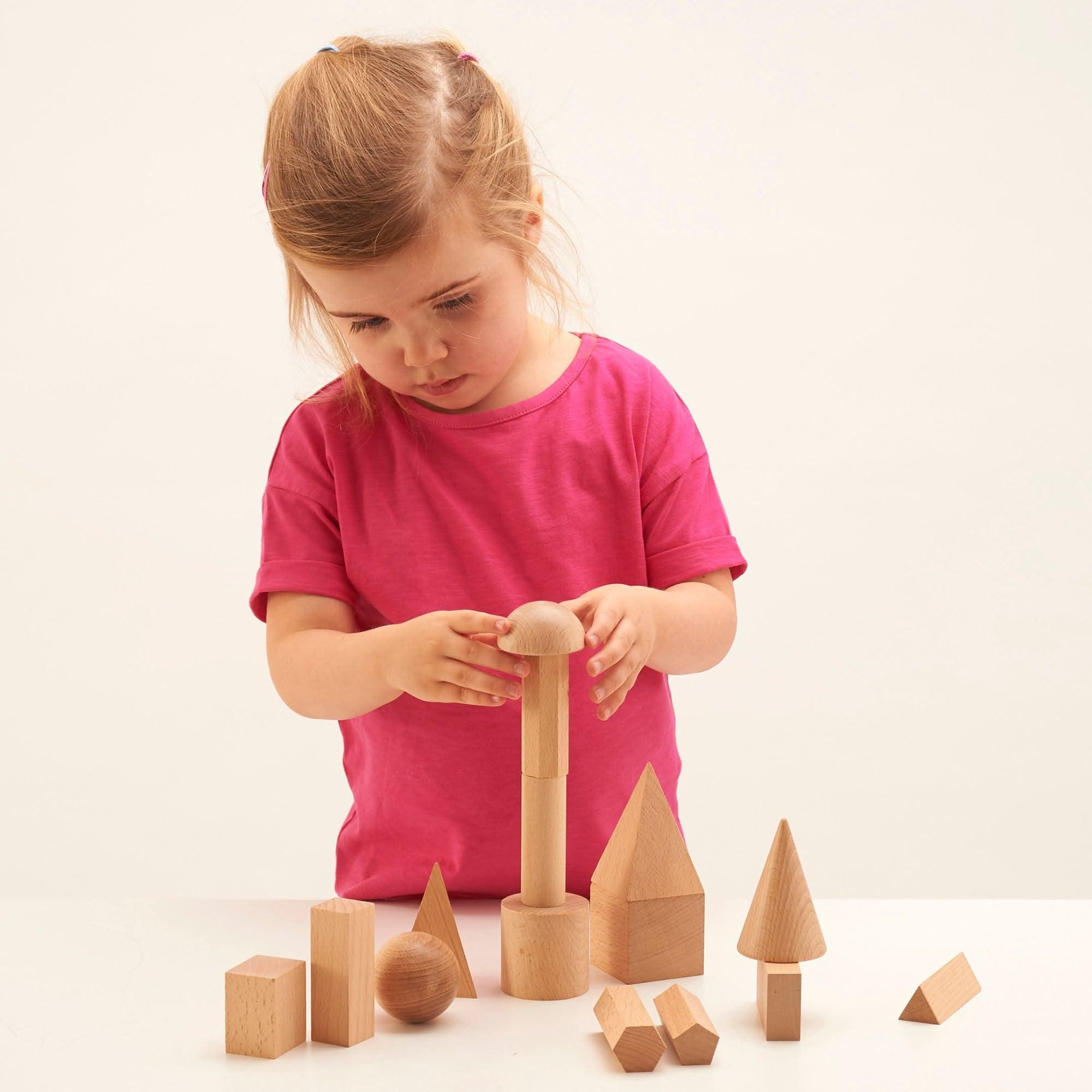 Wooden Geometric Solids - Pk15, Wooden Geometric Solids - Pk15,Geometric shapes,Reception and KS1 geometry resources,geometry resources EYFS, Wooden Geometric Solids – 15-Piece Set for Hands-On Learning The Wooden Geometric Solids set is an essential educational resource to enhance shape recognition, spatial awareness, and mathematical understanding. Made from smooth, durable hardwood, this 15-piece set provides a hands-on approach to exploring the properties and attributes of 3D geometric shapes. Wooden Ge