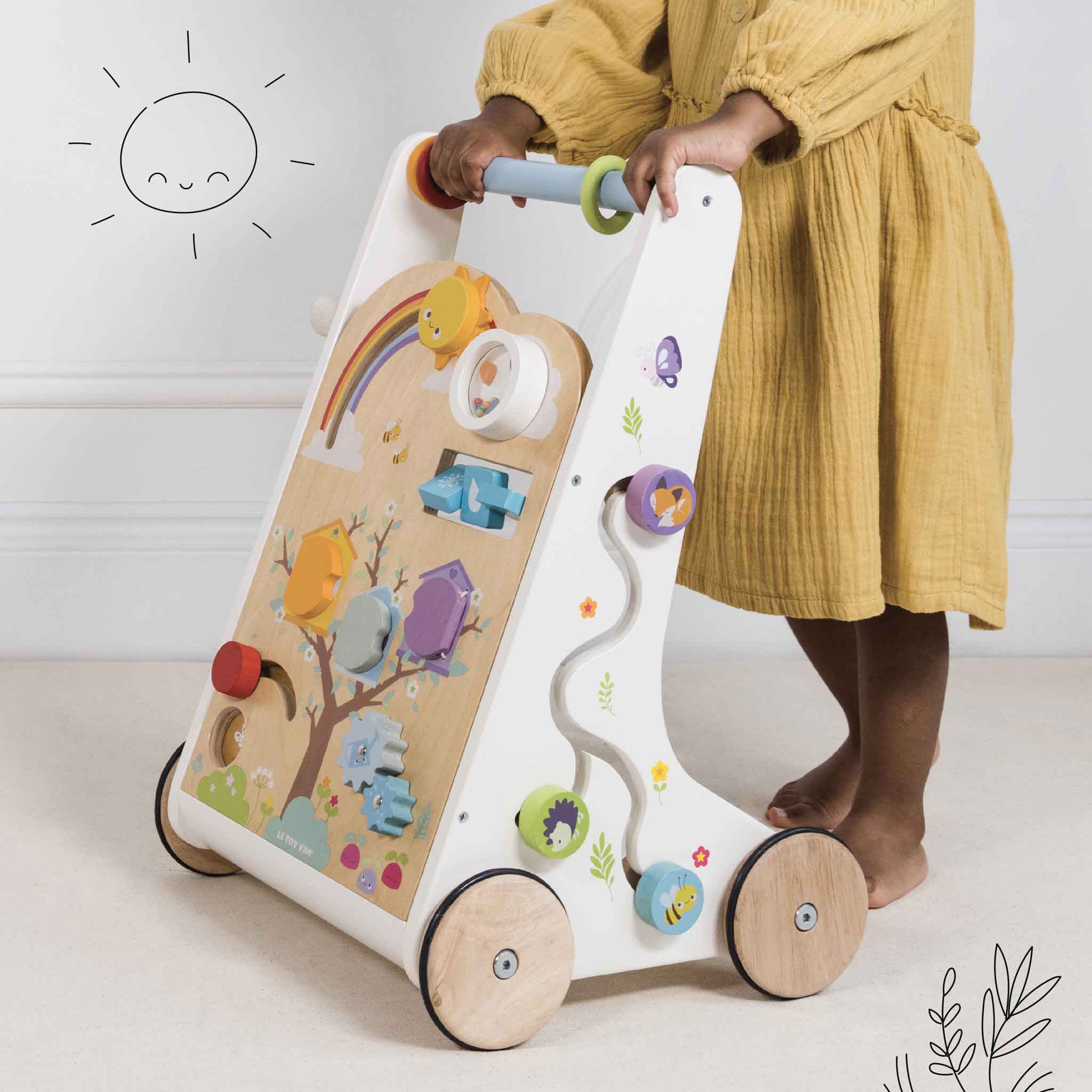 Woodland Activity Baby Walker, Woodland Activity Baby Walker,Wooden Baby Walker,wooden toys,childrens wooden toys,durable wooden toys,educational wooden toys, Woodland Activity Baby Walker – A First Steps Adventure! The Woodland Activity Baby Walker is a beautifully crafted wooden baby walker designed to support little ones as they take their first steps into the world. More than just a walking aid, this multi-functional activity walker is packed with 12 sensory play features, ensuring an engaging and enric